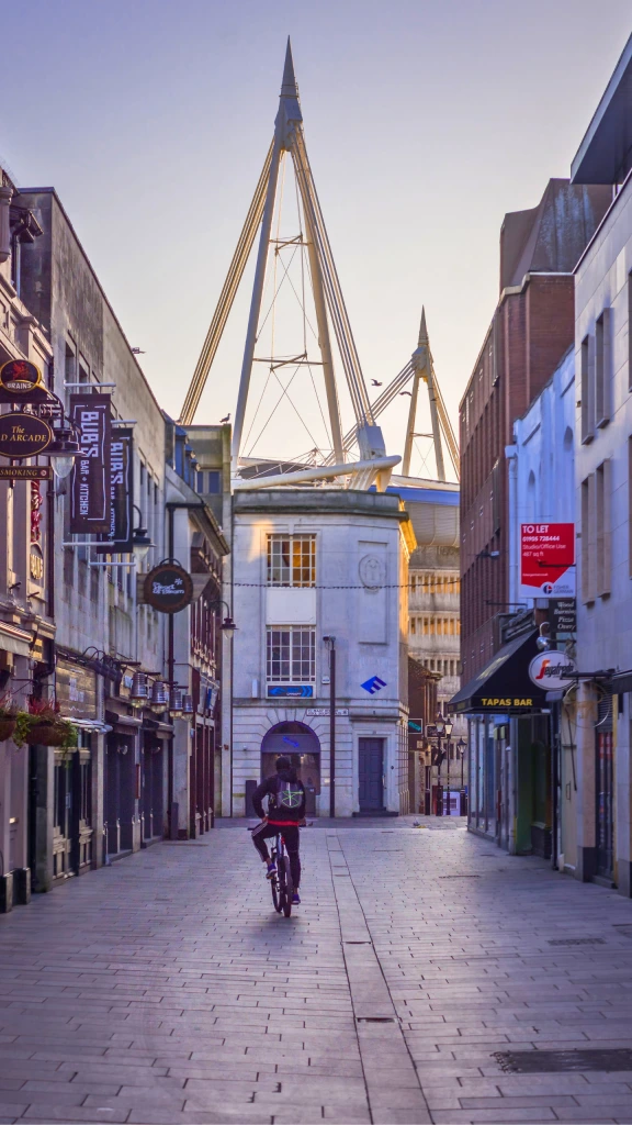 bike riding through street in cardiff