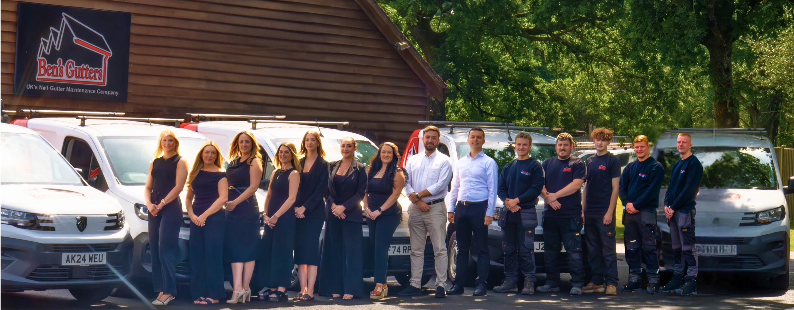 Swindon gutter cleaning team from Ben’s Gutters standing beside service vans