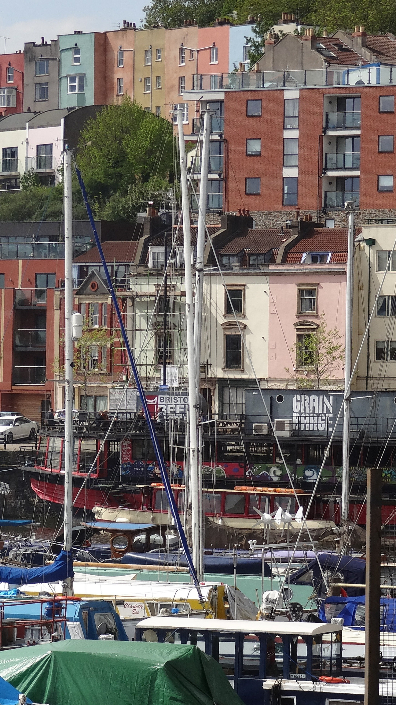 A portrait showing colourful houses and buildings along Bristol Harbourside, representing typical homes in the city that require regular gutter cleaning and maintenance to prevent water damage.