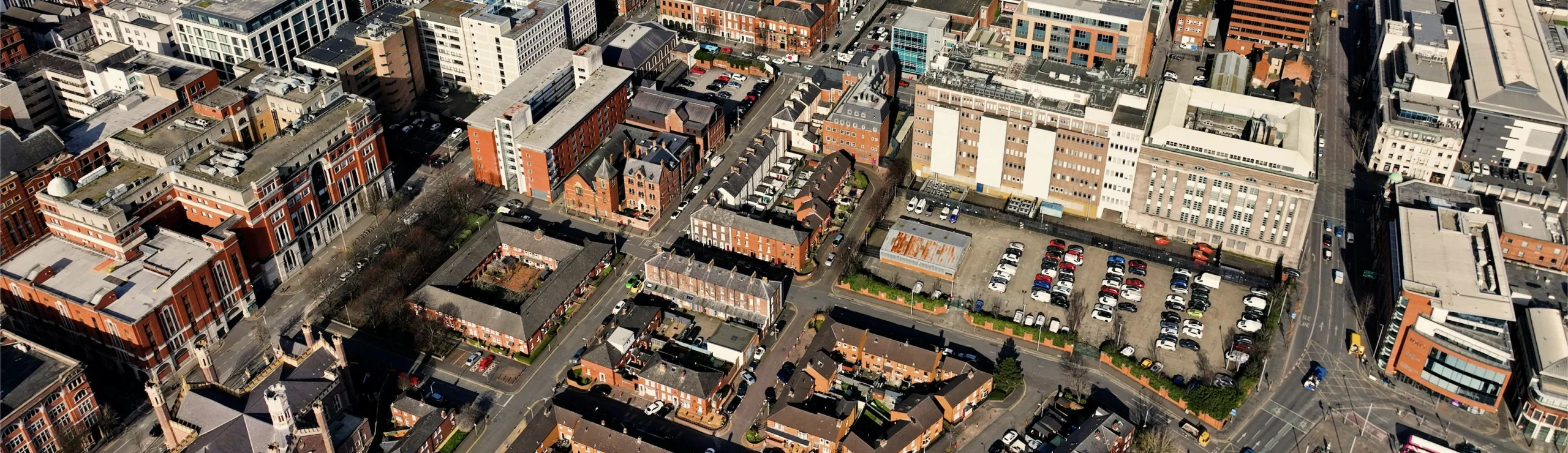 This is an aerial urban landscape of Belfast showing a collage of buildings to provide better context of location where this blog post specializes in.