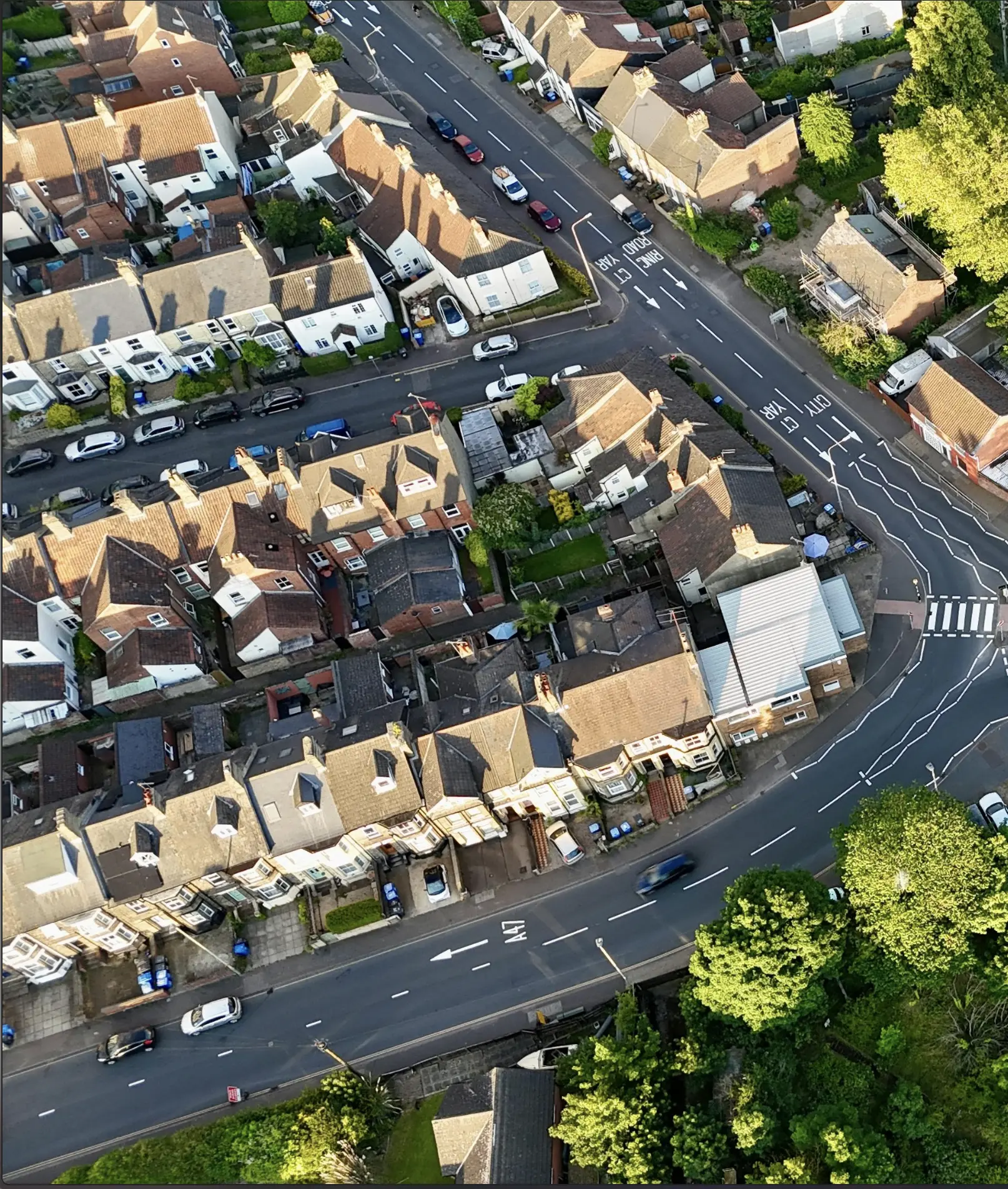 A drone shot of a block on Norfolk showing houses that gutter cleaners commonly tackle daily to provide context.