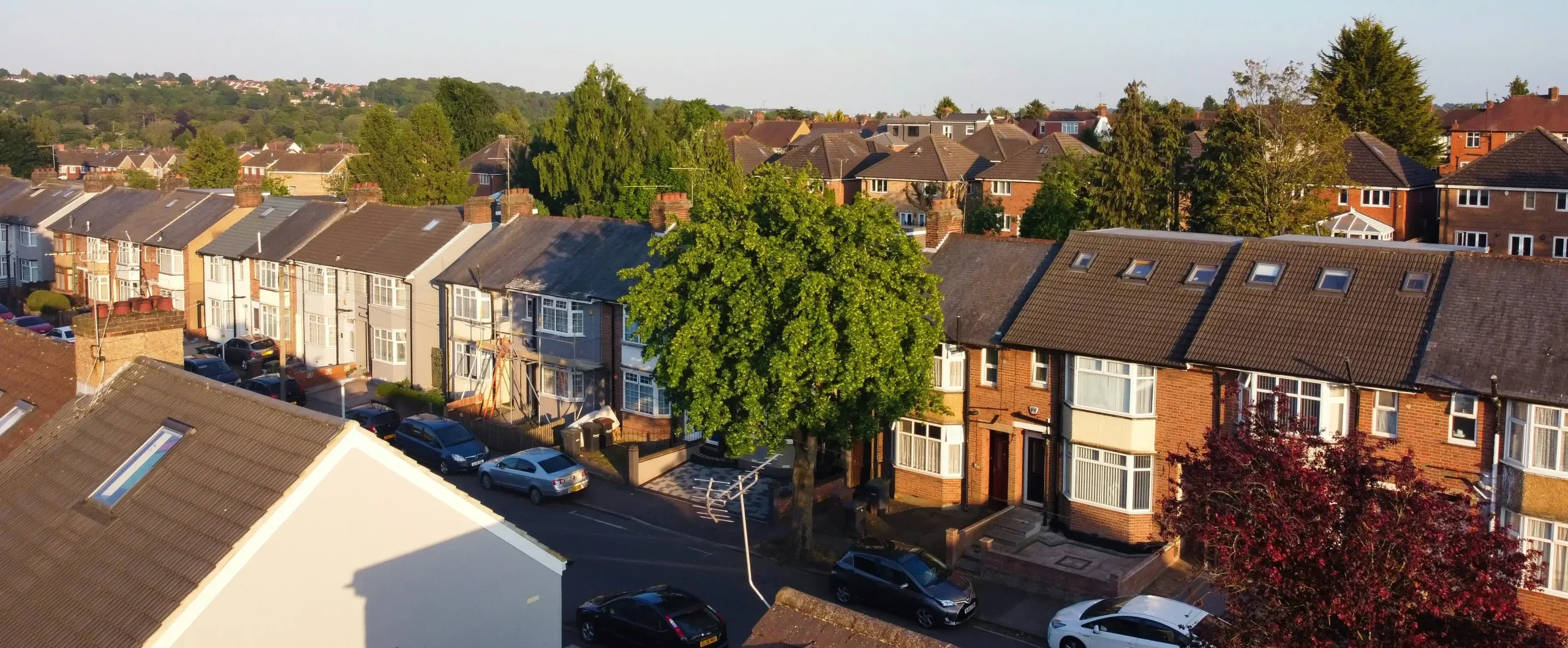 This is a landscape showing a collage of English houses, a zone for a gutter cleaner.