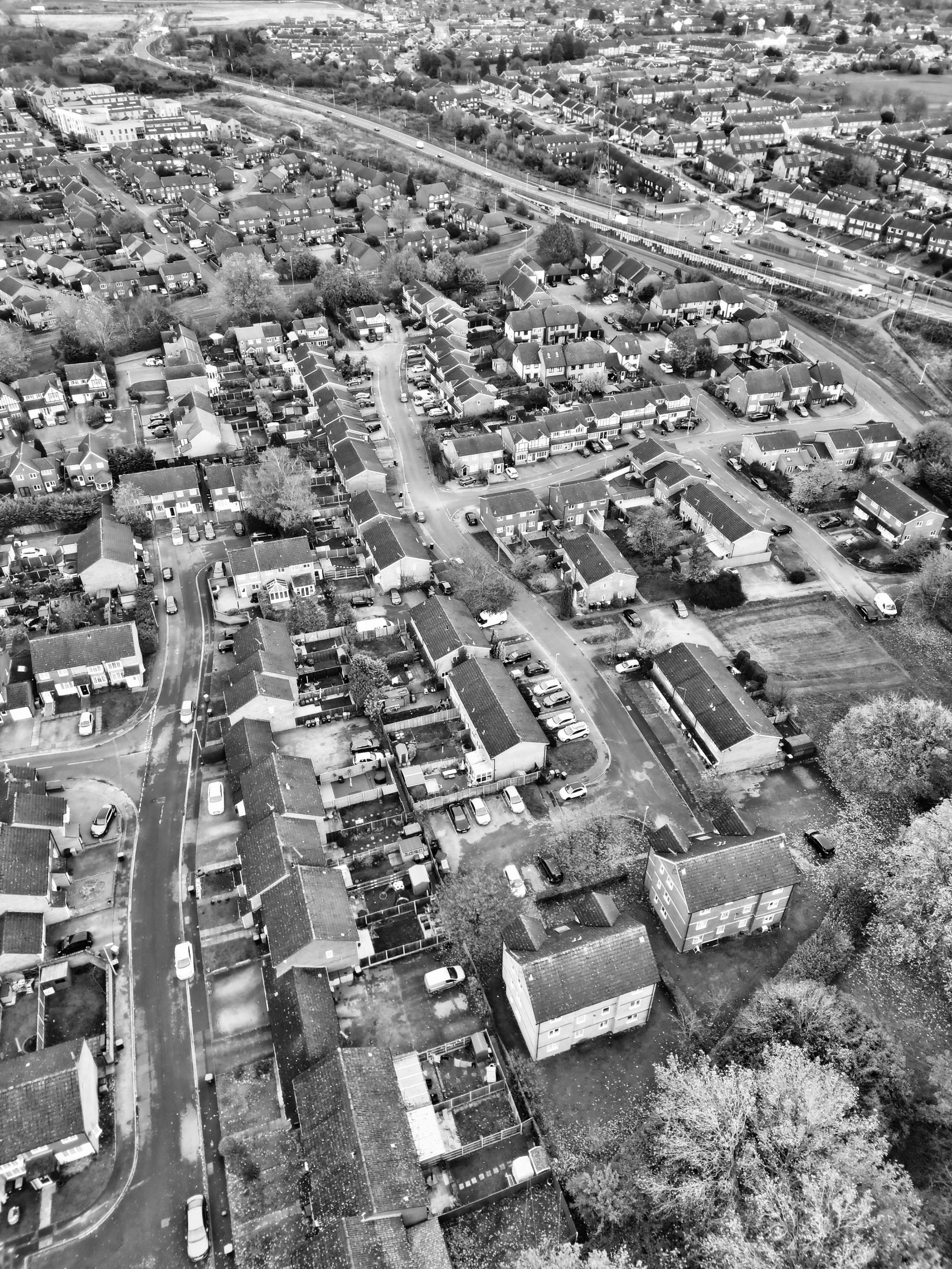 An aerial black and white shot of Bedfordshire showing gutters that need cleaning.