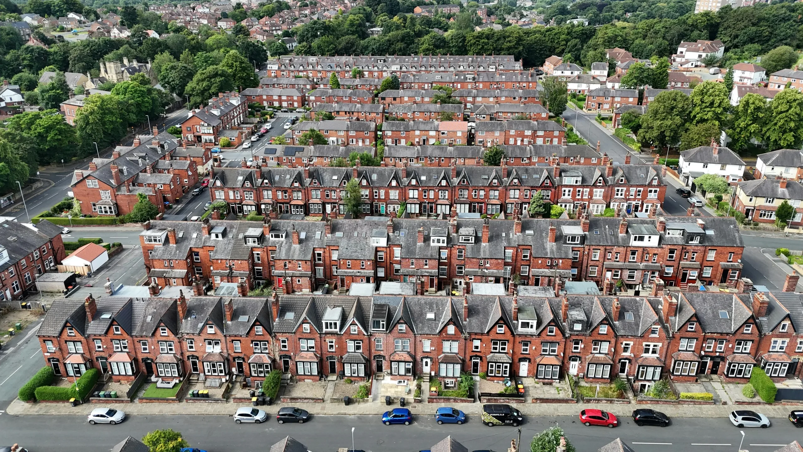 This image shows a neighborhood that needs their gutters cleaned in West Yorkshire.