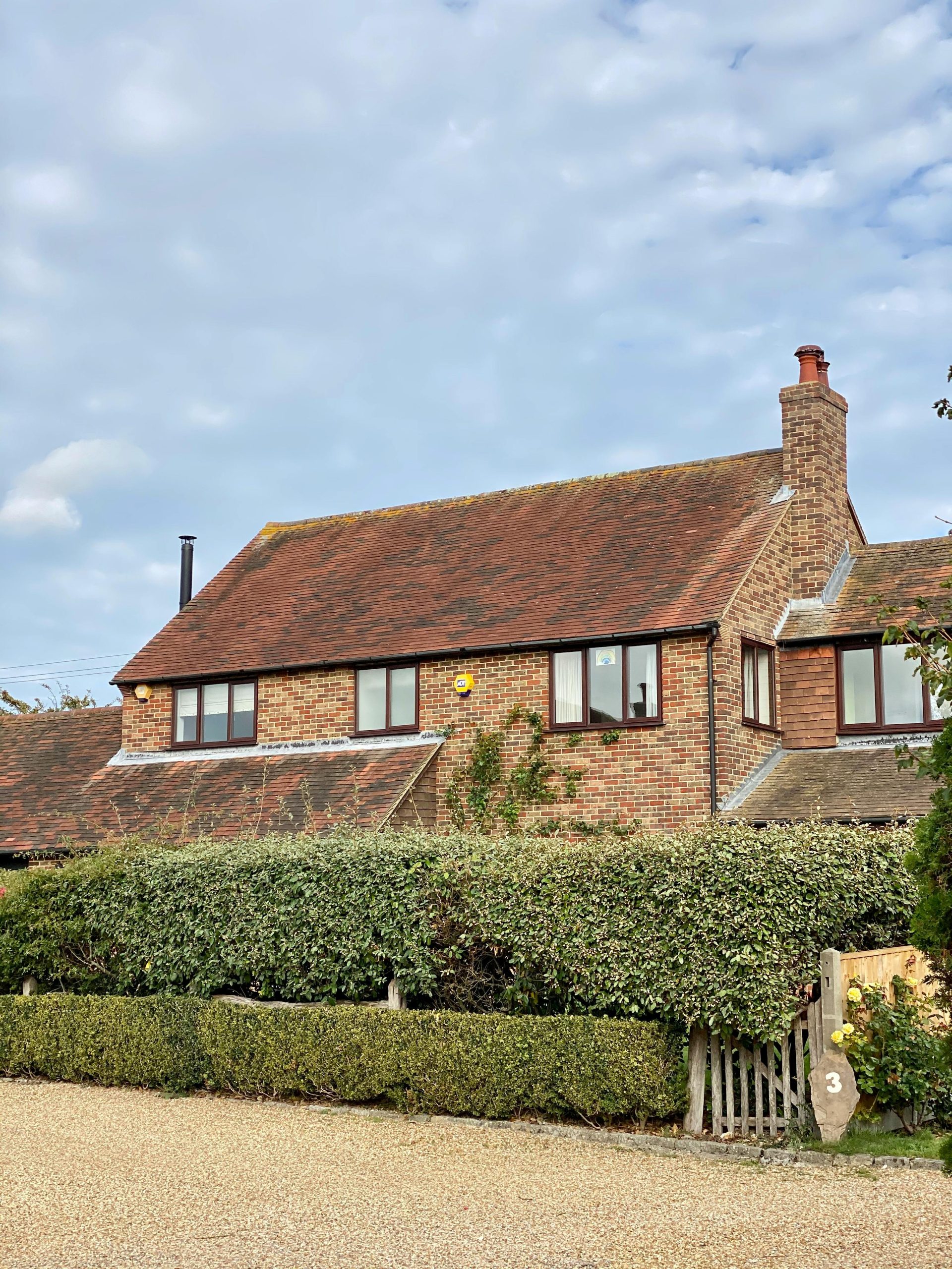 A typical home in West Sussex showing gutters that need cleaning.