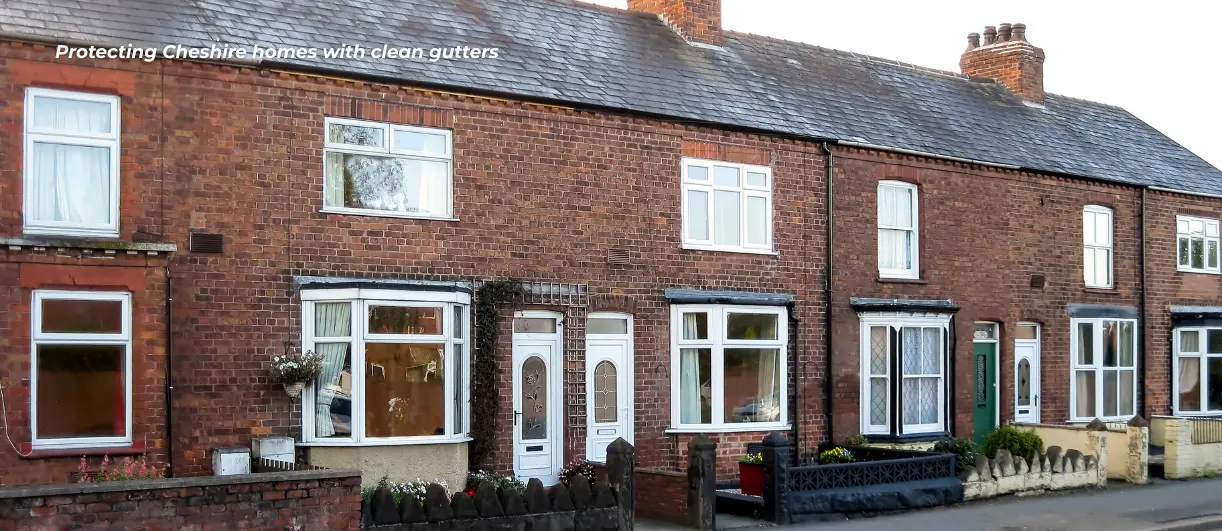 A landscape photo showing a street in Cheshire with houses that need their gutters cleaned.